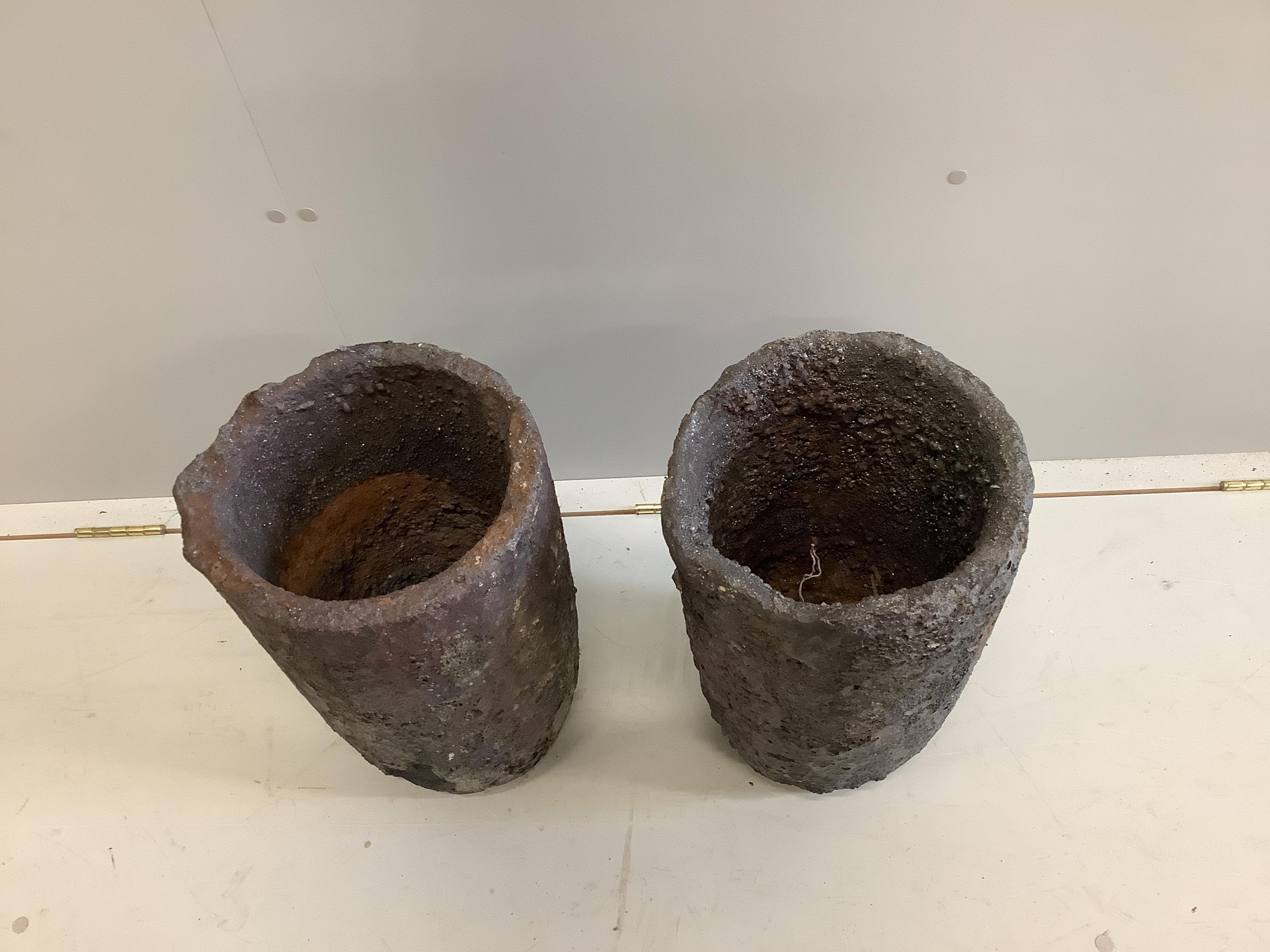 A pair of French Slag Foundry pots, diameter 26cm, height 45cm